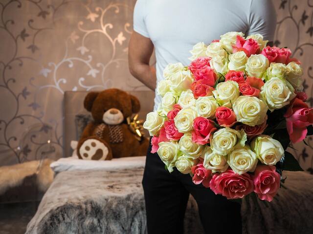 black man holding bouquet of roses flowers 2